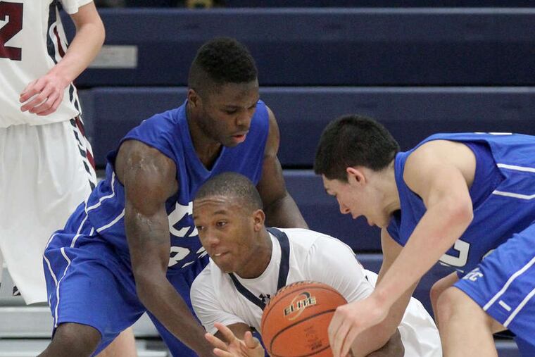 Cardinal O'Hara's Kairi Jones is surrounded by Conwell-Egan defenders Jordan Burney (left) and Vinny Dalessandro. CHARLES FOX / Staff Photographer