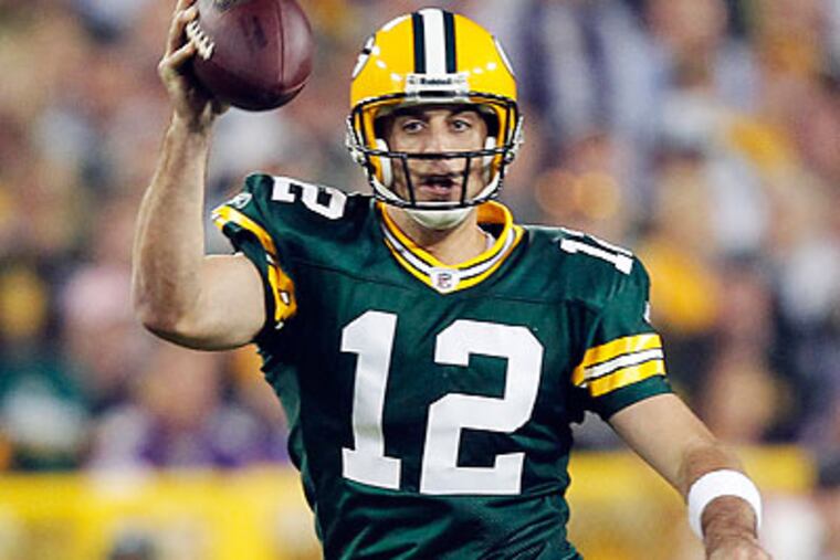 Aaron Rodgers has a league-best 107.4 passer rating against the blitz this season. (Jeffrey Phelps/AP file photo)