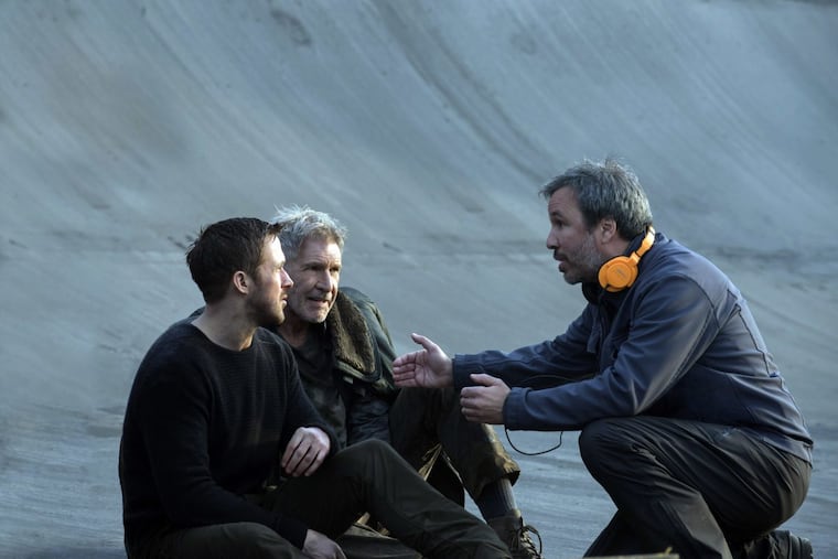 Ryan Gosling (from left), Harrison Ford, and director Denis Villenueve on the set of “Blade Runner 2049.”
