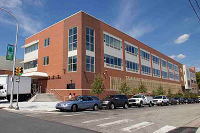 Supplies and equipment arrive at the new West Philadelphia High School last week; students start class on Tuesday. (David M Warren / Staff Photographer)