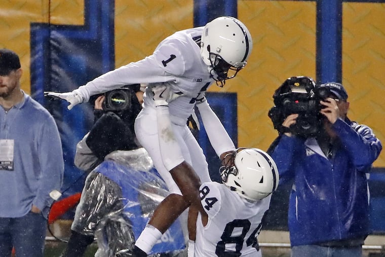 Penn State Juwan Johnson embracing teammate KJ Hamler in game against Pittsburgh on Saturday.