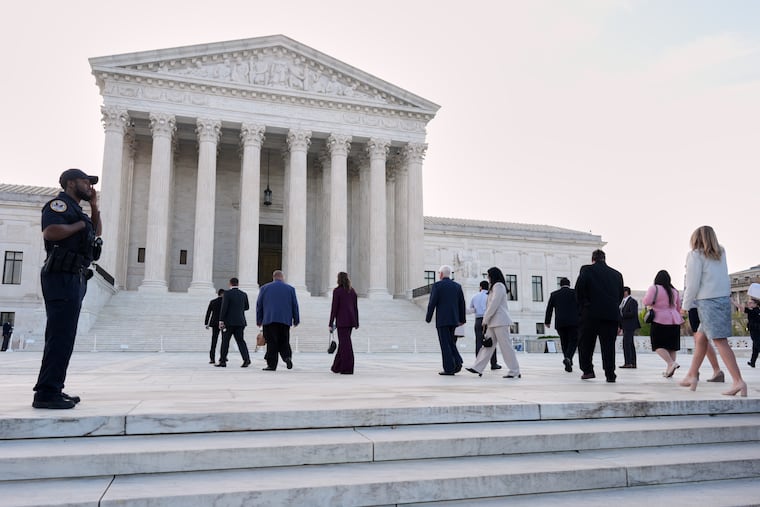 People arrive to walk inside the U.S. Supreme Court, on Capitol Hill in Washington, Wednesday, April 1, 2026. The Supreme Court justices will hear oral arguments today on whether President Donald Trump can deny citizenship to children born to parents who are in the United States without permission.