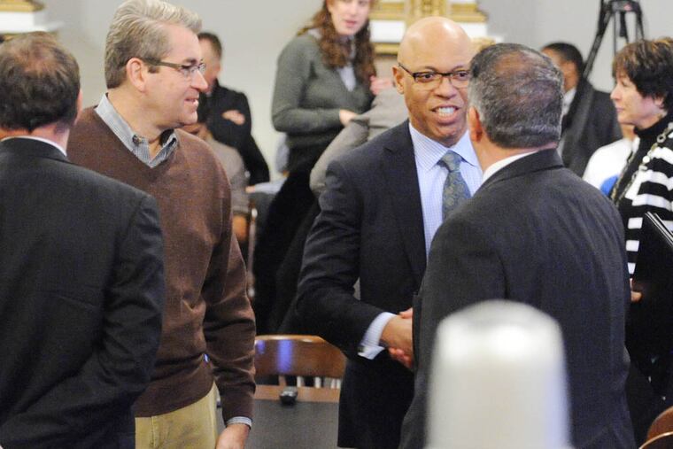School Reform Commission chairman Bill Green (2nd left) and School Superintendent William Hite, introduce themselves to Mike Vereb, PA House of Representatiive and leader of the Pennsylvania Basic Education Commission, before a hearing by the Commission gets underway in City Hall Nov. 18, 2014. ( CLEM MURRAY / Staff Photographer )