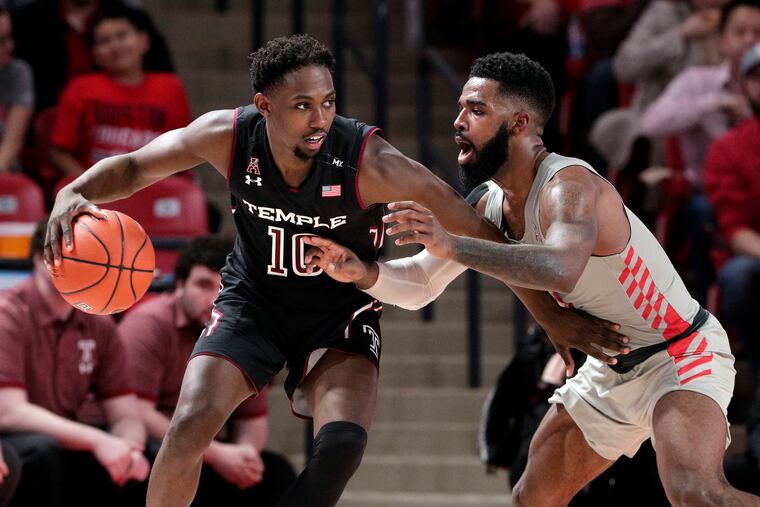 Temple guard Shizz Alston Jr. (10) tries to drive around Houston guard Corey Davis Jr. (5) during the second half of an NCAA college basketball game Thursday, Jan. 31, 2019, in Houston. (AP Photo/Michael Wyke)