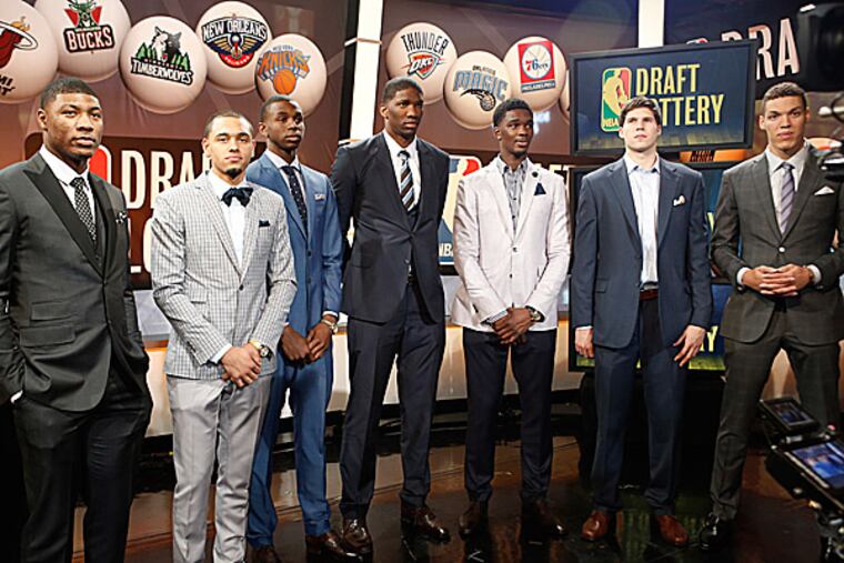NBA draft prospects Marcus Smart of Oklahoma State, Tyler Ennis of Syracuse, Andrew Wiggins and Joel Embiid of Kansas, Noah Vonleh of Indiana, Doug McDermott of Creighton and Aaron Gordon of Arizona. (Kathy Willens/AP)