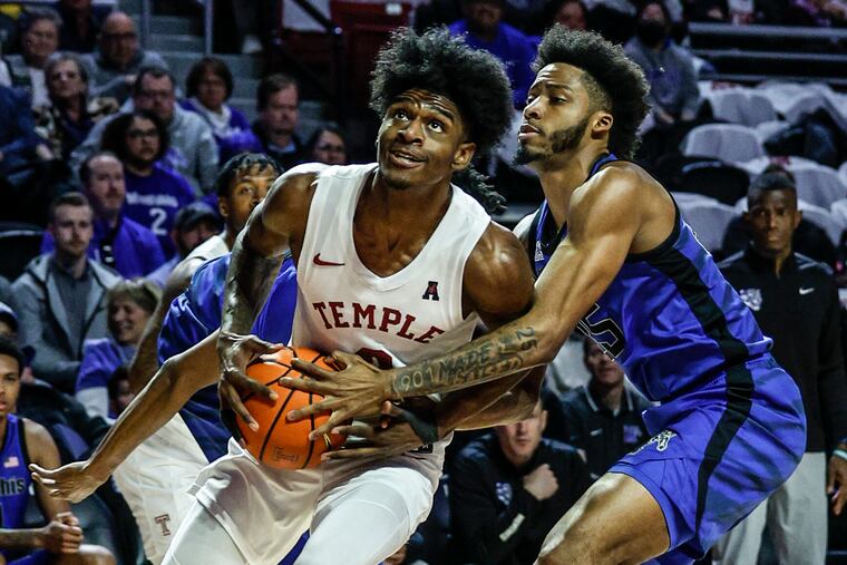Temple's Jahlil White drives on Memphis' Jayden Hardaway at the Liacouras Center on Feb. 8.