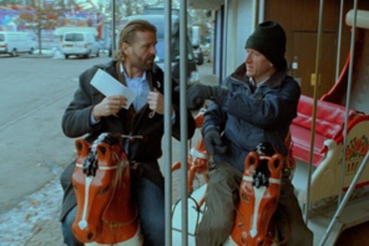 Peter Gantzler (left) and Jens Albinus star in "The Boss of It All." It's a frothy and slight film - or maybe it isn't.