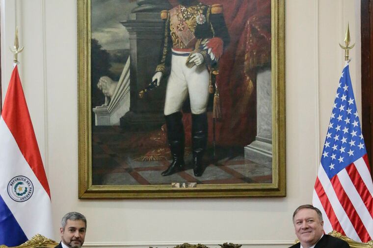U.S. Secretary of State Mike Pompeo, right, listens to Paraguay's President Mario Abdo Benitez, during official meeting at "Palacio de Lopez", in Asuncion, Paraguay, Saturday, April 13, 2019. Pompeo is in the second of four countries' tour that includes Chile, Peru and Colombia to address, mainly, the crisis in Venezuela. On the wall is a paint of National Hero Marshal Francisco Solano Lopez.