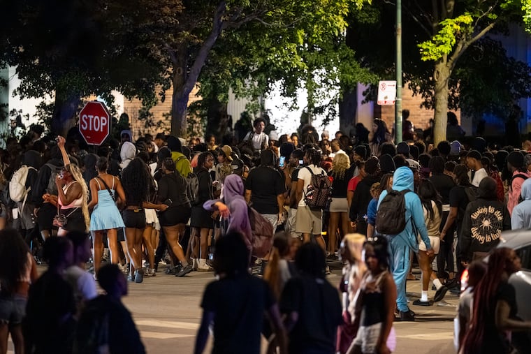 Hundreds of young people gather near the Griffin Museum of Science and Industry in the Hyde Park neighborhood as Chicago police officers attempt to disperse them, Monday, May 25, 2026.