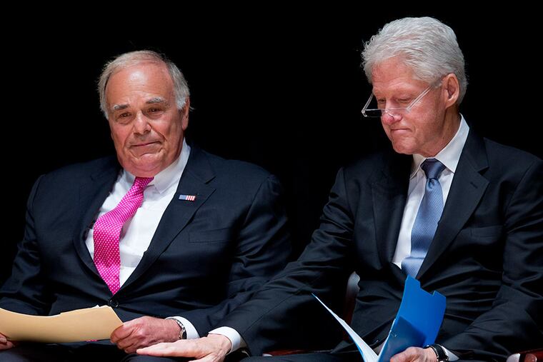 Former President Bill Clinton places a hand on former Pennsylvania Gov. Ed Rendell after Rendell spoke during a public memorial service for Philadelphia Inquirer co-owner Lewis Katz Wednesday, June 4, 2014, at Temple University in Philadelphia.