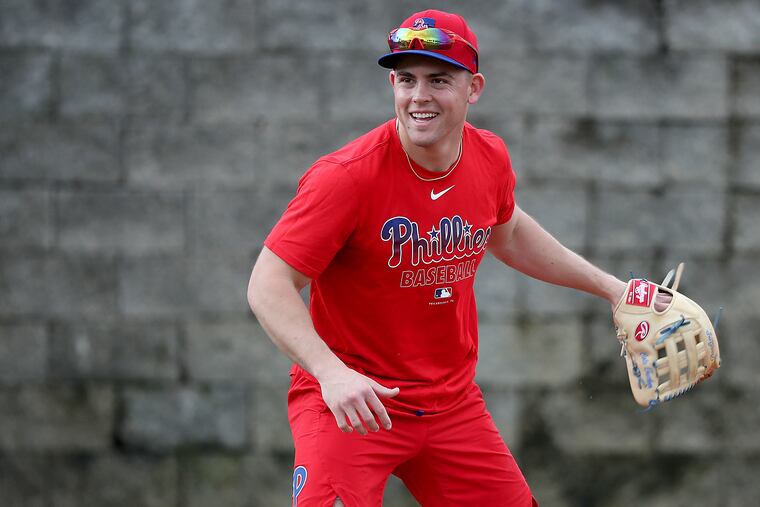 Scott Kingery laughs after he fields a ground ball at Phillies spring training.