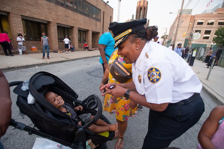Philadelphia Sheriff Rochelle Bilal jokes around with a child during a National Night Out Event in the 39th Police District.