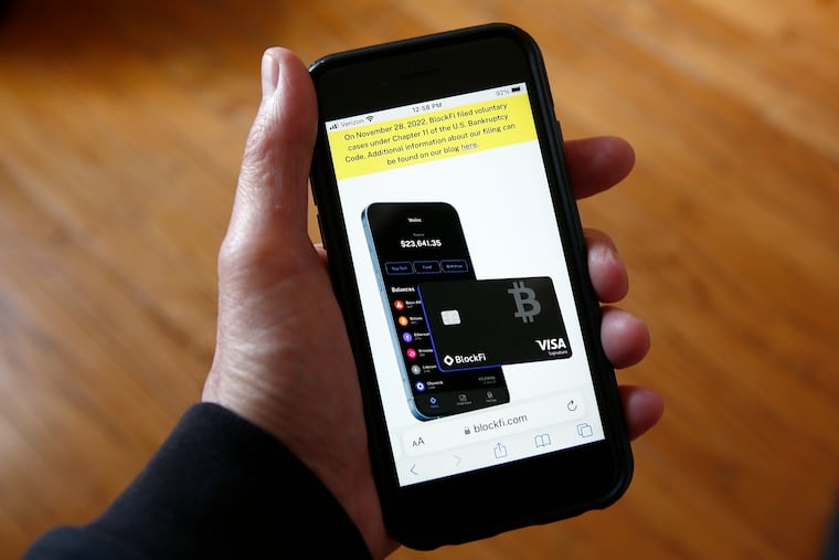 Text, in yellow, announcing cryptocurrency lender BlockFi's bankruptcy filing appears on the company website on a smart phone on Monday.