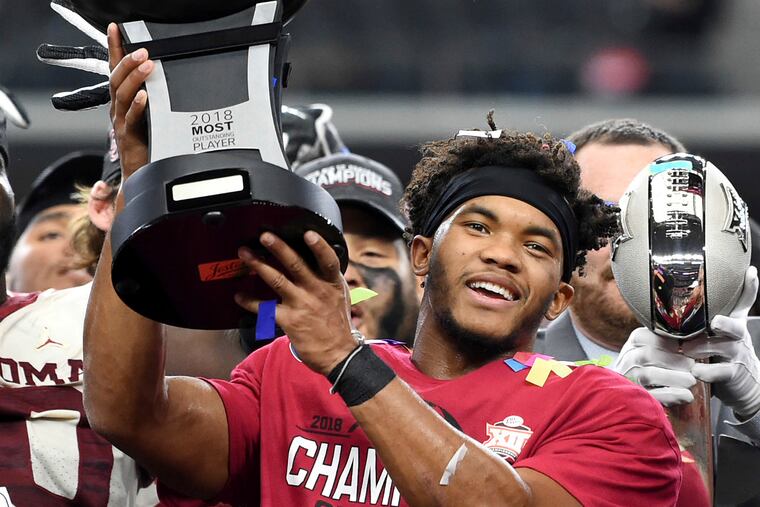 Oklahoma quarterback Kyler Murray hoists the Most Outstanding Player trophy after beating Texas 39-27 in the Big 12 Conference championship NCAA college football game on Saturday, Dec. 1, 2018, in Arlington, Texas. (AP Photo/Jeffrey McWhorter)