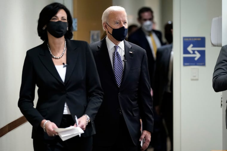 Rochelle Walensky, director of the Centers for Disease Control and Prevention, leads President Joe Biden into the room for a COVID-19 briefing at the headquarters for the CDC in Atlanta on March 19, 2021. Walensky is making an impassioned plea to Americans not to let their guard down in the fight against COVID-19, warning on March 29 of a potential “fourth wave” of the virus.