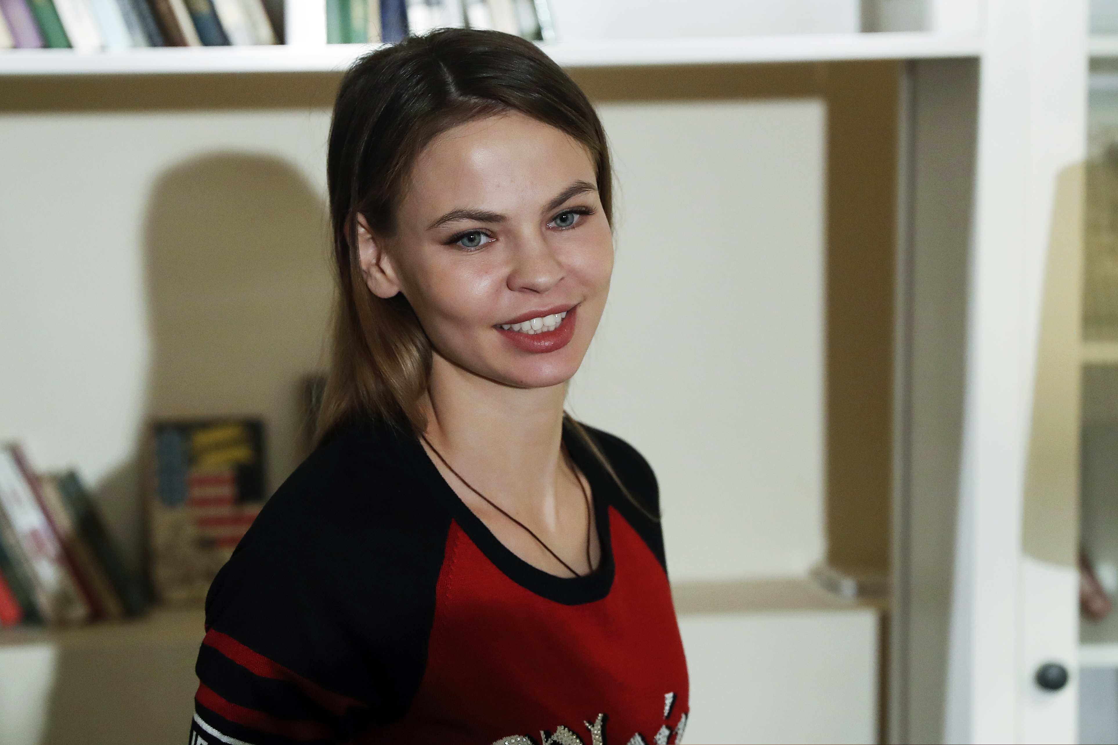 Belarusian model Anastasia Vashukevich, also known on social media as Nastya Rybka, smiles during an interview with the Associated Press in Moscow, Russia, Friday, Feb. 1, 2019. Anastasia Vashukevich who has claimed to have information on the ties between Russians and the Donald Trump election campaign says that she has turned it over to Russian billionaire businessman Oleg Deripaska. (AP Photo/Pavel Golovkin)