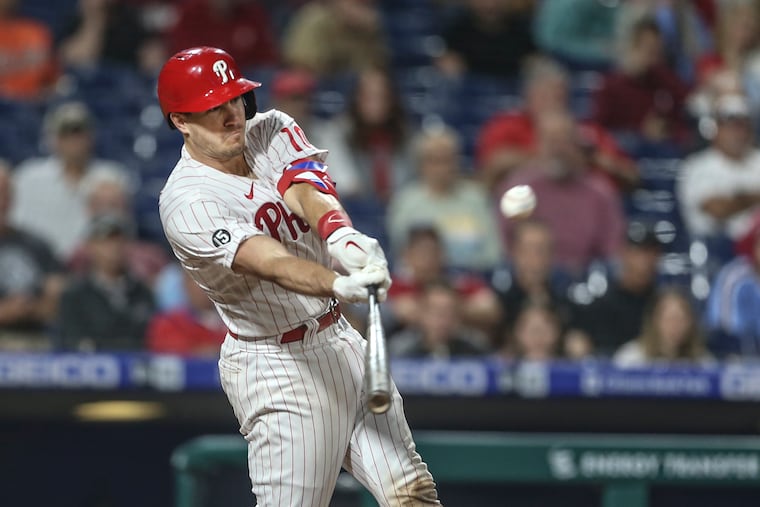 J.T. Realmuto hits a walk-off, two-run triple against the Orioles in the 10th inning on Tuesday night.