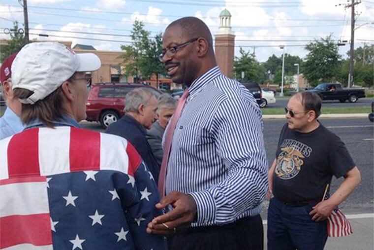 Garry Cobb, Republican candidate challenging State Sen. Donald Norcross, joins protesters outside a Cherry Hill restaurant where Senate Majority Leader Harry Reid will attend a pricey fund-raiser for Norcross' congressional campaign.