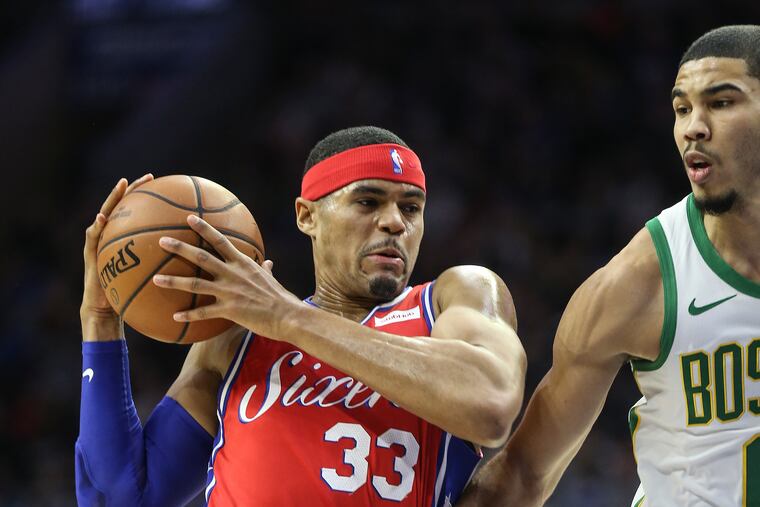 Sixers' Tobias Harris drives on Celtics' Jayson Tatum during the first quarter at the Wells Fargo Center in Philadelphia, on Feb. 12, 2019.