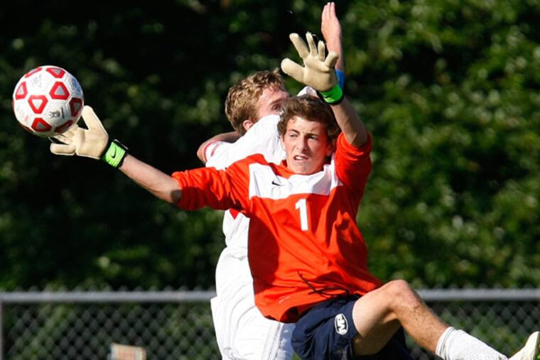 Malvern Prep goalie Connor McNeill (right) keeps the ball away from Holy Ghost Prep's Colin O'Neill (left) in a 2012 game. With O'Neill having graduated, the Firebirds are off to a slow start. ( Michael S. Wirtz / Staff Photographer )