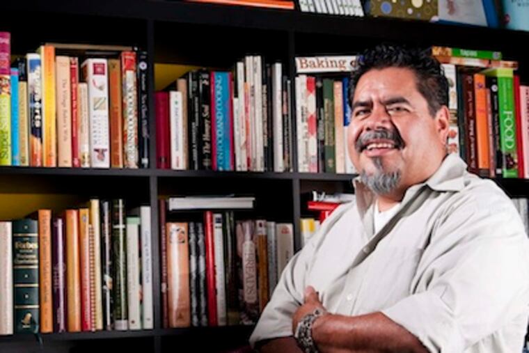 Friday, August 31, 2012 (Kriston J. Bethel / For the Daily News)
FOOD06F; 902 Burdette Street, Downingtown, Pa.; cookbook collectors
Chef Guillermo Tellez stands beside his collection of hundreds of cookbooks, some dating as far back as the early 19th century.