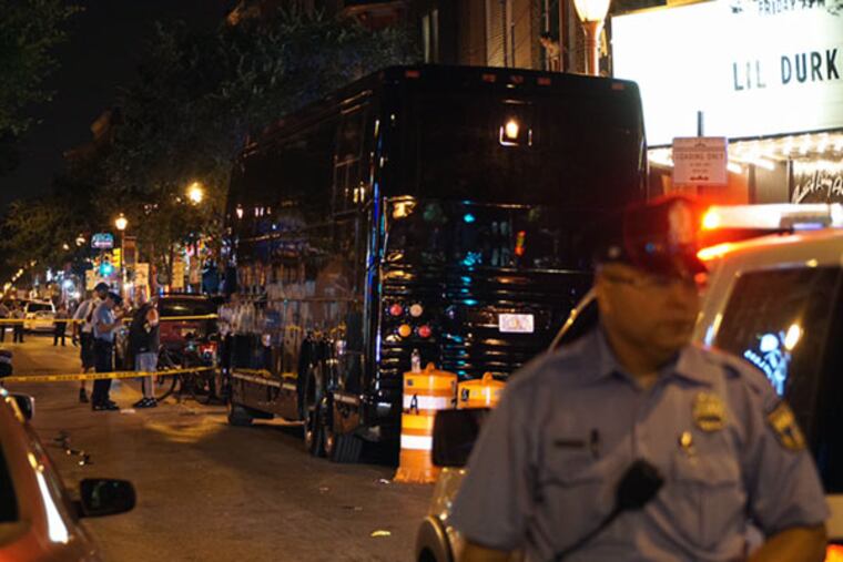 Police secure the crime scene on South Street, where a man was fatally shot. (Joseph Kaczmarek/For the Daily News)