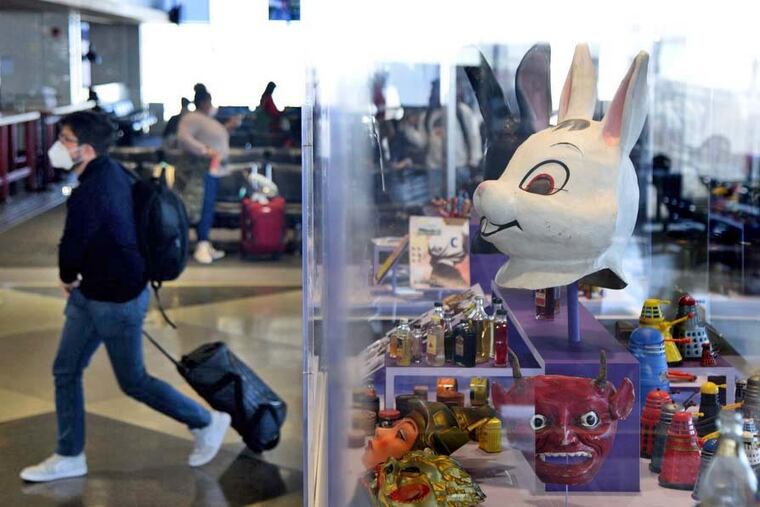 Masks from Adam Wallacavage, are among the eclectic selection of objects from Philly airport staff members, in “Private Collections: Personal Obsessions,” on display in PHL’s Terminal D.