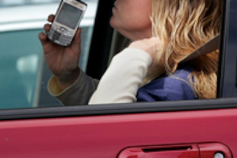 Drivers caught holding a phone couldbe fined $75.