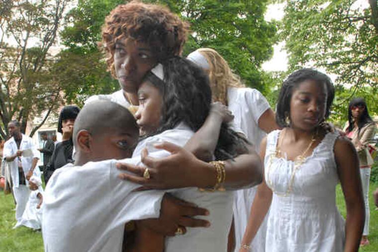 Mourners wait outside the church after the funeral. Eight clergy led prayers at Bala United Methodist Church in Bala Cynwyd.