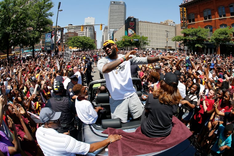 LeBron James celebrates during the Cleveland Cavaliers victory parade after their 2016 NBA title.