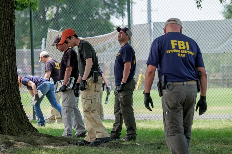 FBI agents look for evidence at a park in Alexandria, Virginia, on June 15, 2017. (Washington Post photo.)