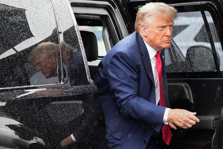 Former President Donald Trump arrives to board his plane at Ronald Reagan Washington National Airport in August.