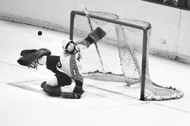 Flyers goalie Bernie Parent making a kick save in Game 7 of the 1975 Stanley Cup semifinals against the New York Islanders.