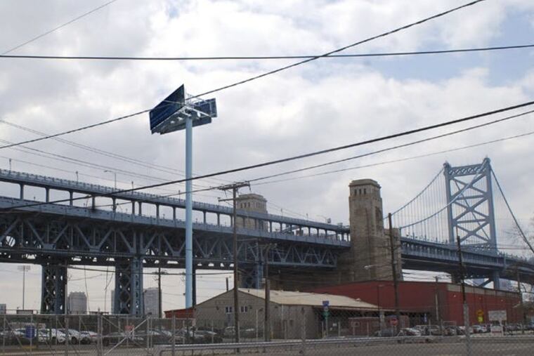 Photo illustration of a proposed billboard as it would appear from the 600 block of Point Street. Although profits from billboard advertising would benefit city organizations, some neighborhood residents and waterfront development advocates are opposed.