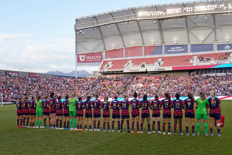 Players of the U.S. women's soccer team's current roster lined up on the field before Tuesday's win over Colombia in suburban Salt Lake City.