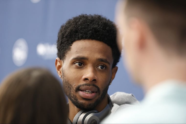 Larry Drew II talking to reporters during Sixers minicamp last June.
