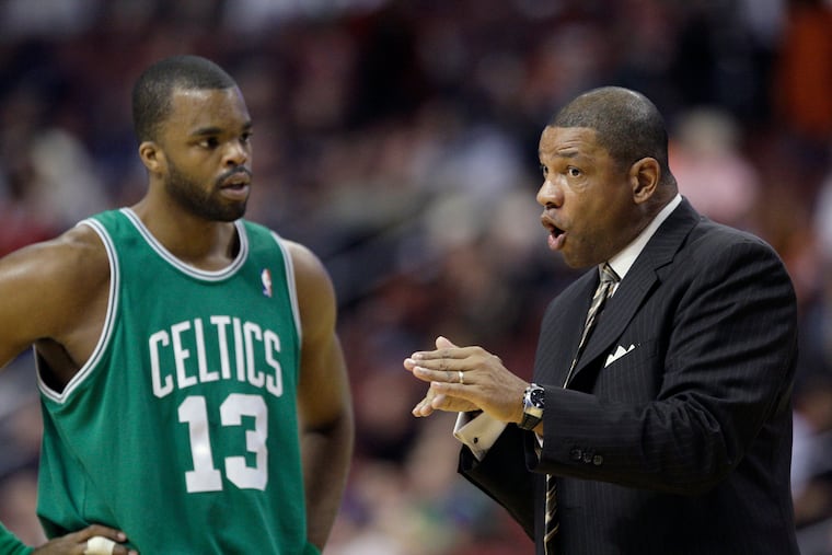Boston Celtics coach Doc Rivers, right, talks with forward Shelden Williams during an NBA basketball game against the Philadelphia 76ers, Tuesday, Nov. 3, 2009, in Philadelphia. (AP Photo/Matt Slocum)