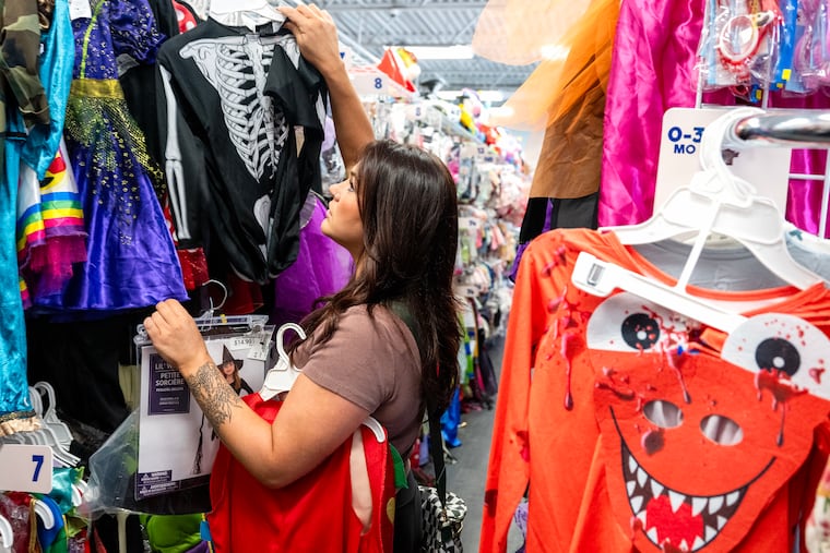 Megan Marotta, of Pitman, shops for Halloween costumes for her two young daughters at Once Upon a Child in Deptford, N.J., on Monday, Sept. 22, 2025. The South Jersey store sells Halloween costumes for $8.86 on average.