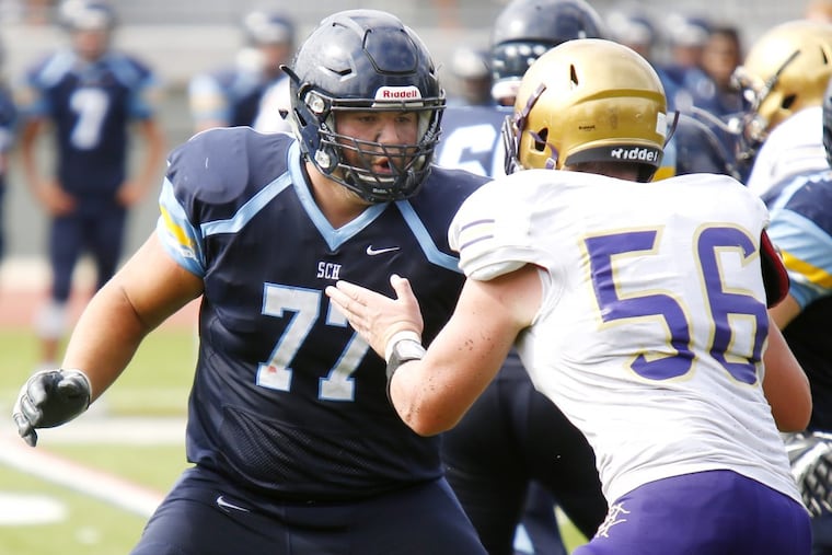 Springside Chestnut Hills Anthony Marrone (77) blocks Roman Catholic’s Michael Leyland (No. 56) in a nonleague contest last season.