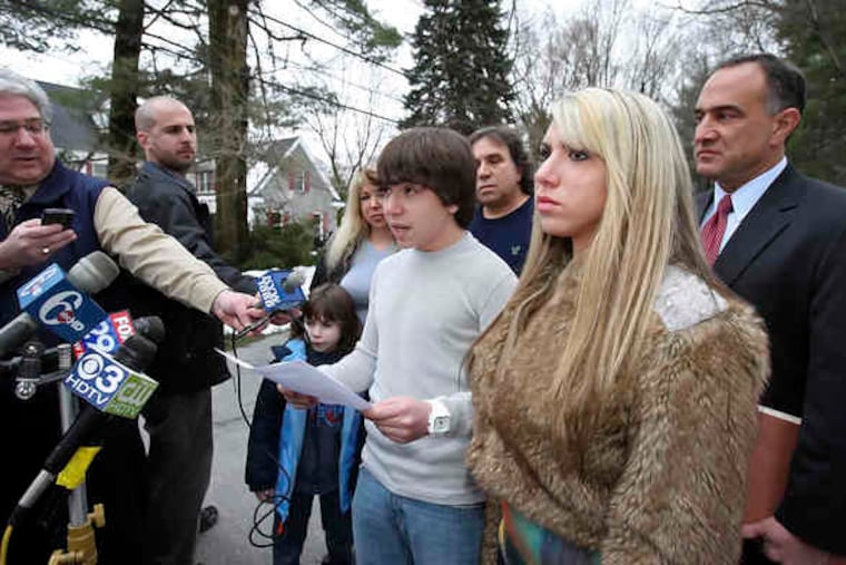 Web cam victim Blake Robbins, at his home with his family and attorney Mark Halzman (at right), reads a family statement in response to the Lower Merion School District statement made earlier today, Wednesday, February 24, 2010.