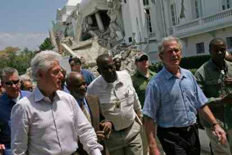 Former Presidents Bill Clinton and George W. Bush arrive at the quake-battered national palace with Haiti's president, Rene Preval (second from left). Clinton and Bush, named by President Obama to lead U.S. fund-raising efforts, were in Haiti yesterday to assess needs and keep attention on Haiti's plight. Story, A3.