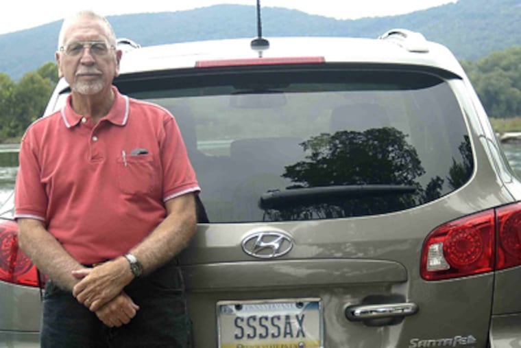 George Snokes, of Mechanicsburg, Pa., with the SSSSAX vanity plate on his Hyundai Santa Fe. (Photo by Susan Ecenbarger)