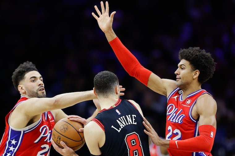 Sixers guard Matisse Thybulle (left) and forward Georges Niang defend Chicago Bulls guard Zach LaVine on Jan. 6.