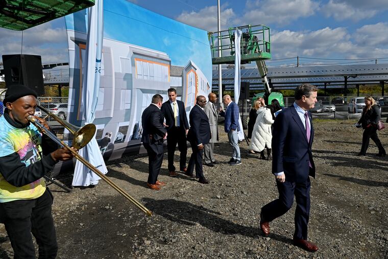 Local officials, including U.S. Rep. Donald Norcross (right), at a ground-breaking ceremony Wednesday in Camden's Whitman Park neighborhood for Virtua Health and the Michaels Organization's $24 million apartment building with affordable rental units and a clinic on the ground floor.