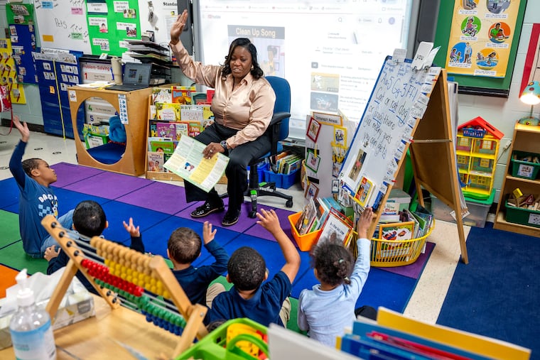 Teaching assistant Angela Feliciano reads with students in a pre-K classroom at the Riletta Twyne Cream Early Childhood Center in Camden on Feb. The New Jersey Education Association named her its Educational Support Professional of the Year for 2025-2026.