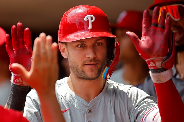 Philadelphia Phillies' Trea Turner celebrates his solo home run against the Minnesota Twins in the fifth inning of a baseball game Wednesday, July 24, 2024, in Minneapolis. (AP Photo/Bruce Kluckhohn)