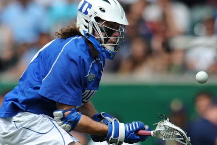 Brendan Fowler flips the ball up after winning another face off during the NCAA Div. I championship game in Philadelphia May 27, 2013. (Clem Murray/Staff Photographer)