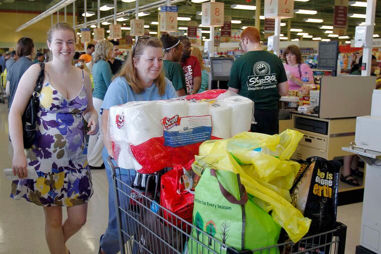 Kim Knows and her mother , Donna Knows, from Blackwood, leave the new Lawnside ShopRite with a heavily loaded cart and smiles. AKIRA SUWA / Staff Photographer
