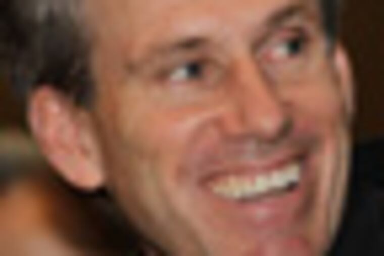 In this photo taken Monday, April 11, 2011, then U.S. envoy Chris Stevens attends meetings at the Tibesty Hotel where an African Union delegation was meeting with opposition leaders in Benghazi, Libya. Libyan officials say the U.S. ambassador and three other Americans have been killed in an attack on the U.S. consulate in the eastern city of Benghazi by protesters angry over a film that ridiculed Islam's Prophet Muhammad. (AP Photo/Ben Curtis)