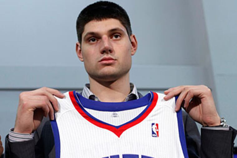 Sixers rookie Nikola Vucevic, aformer USC forward, was picked at No. 16 in the NBA draft. (Matt Rourke/AP Photo)